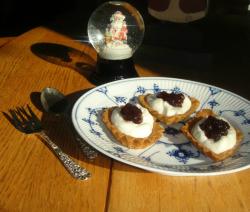 Sandbakkels, whipped cream, and lingonberry jam